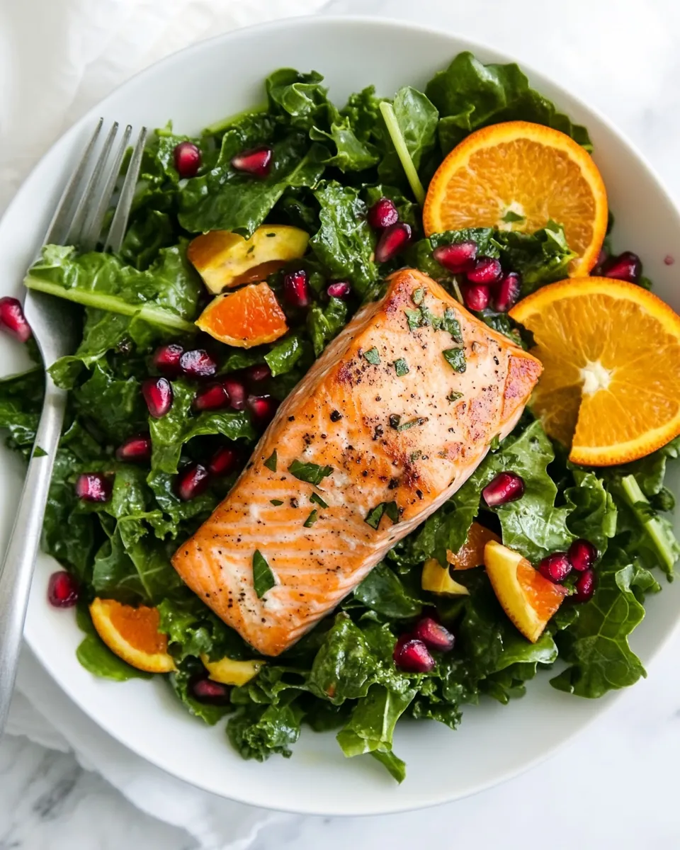 Easy Kale Salad Recipe With Salmon, Pomegranate, And Orange-Coconut Vinaigrette dish photo